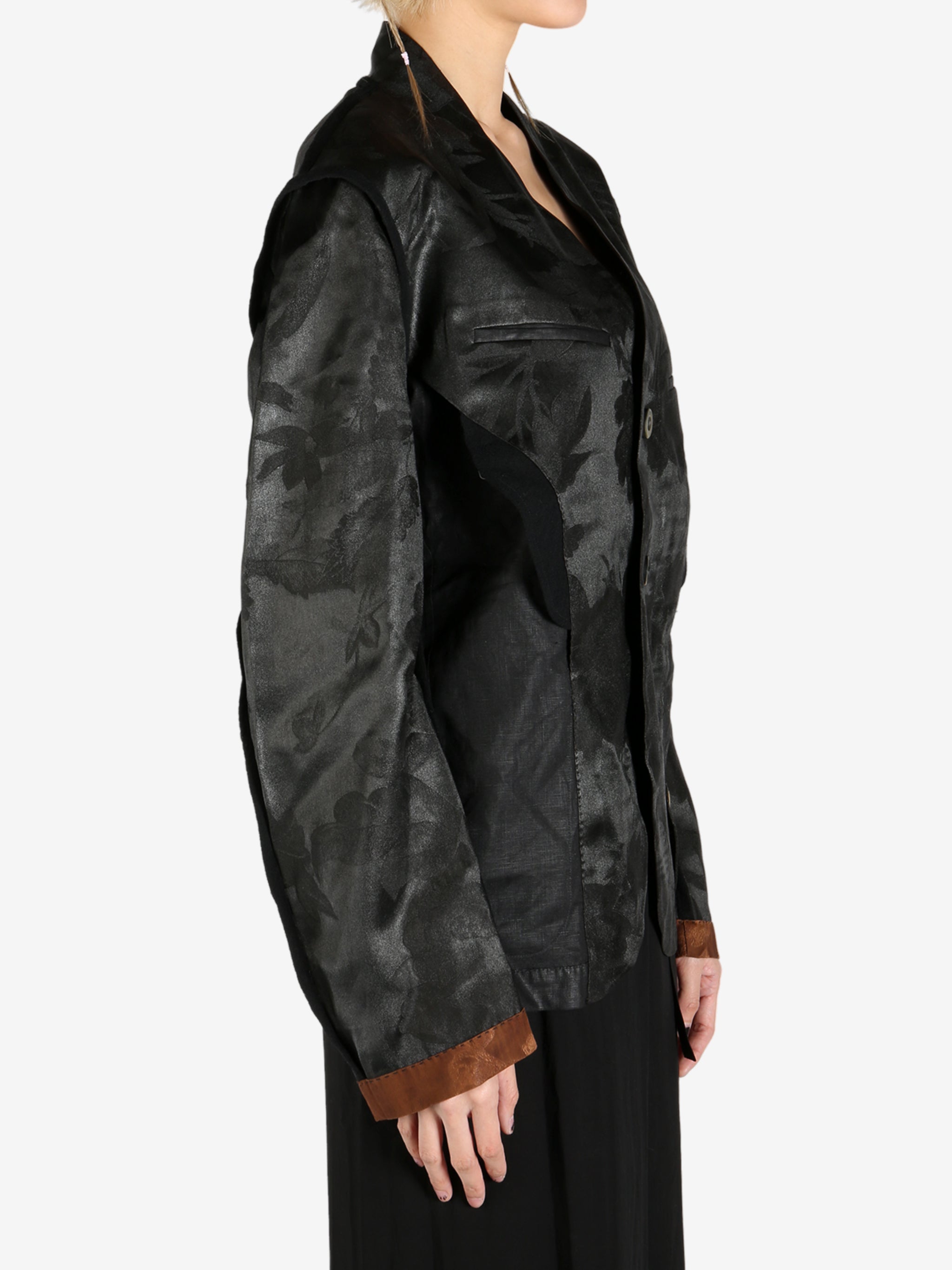 Black jacket worn by a person, showing the jacket's fit