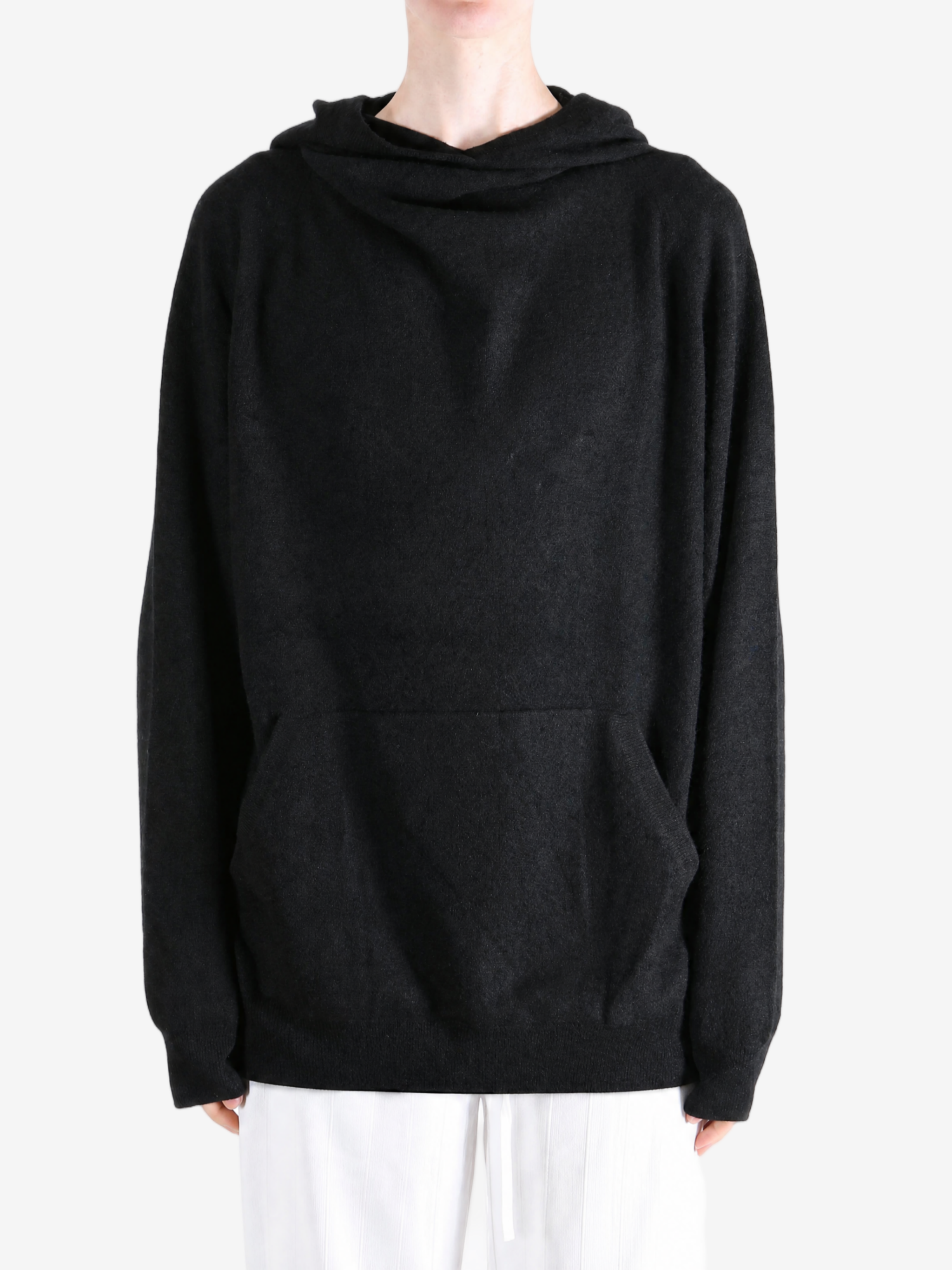 Black hoodie worn by a person, showing the hoodie fit