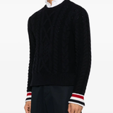 Navy knitwear worn by a person, showing the knitwear fit