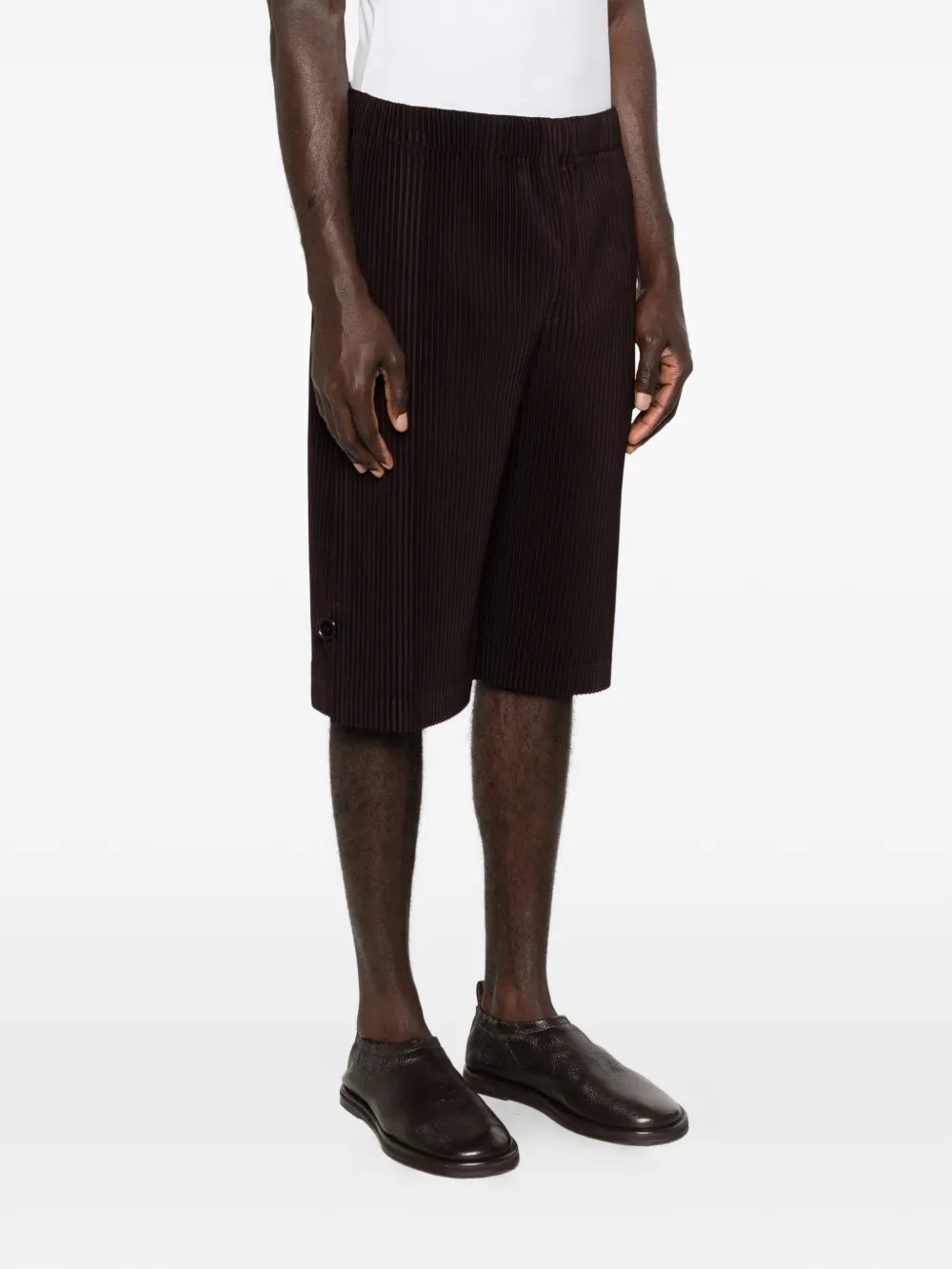 Black pant worn by a person, showing the pant's fit