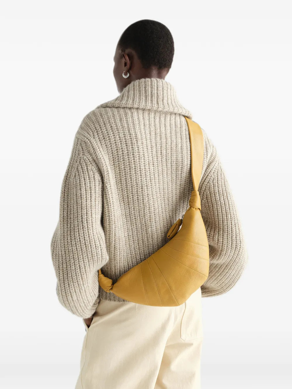 Tan bag worn by a person, showing the bag fit