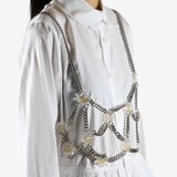 White top worn by a person, showing the top's fit