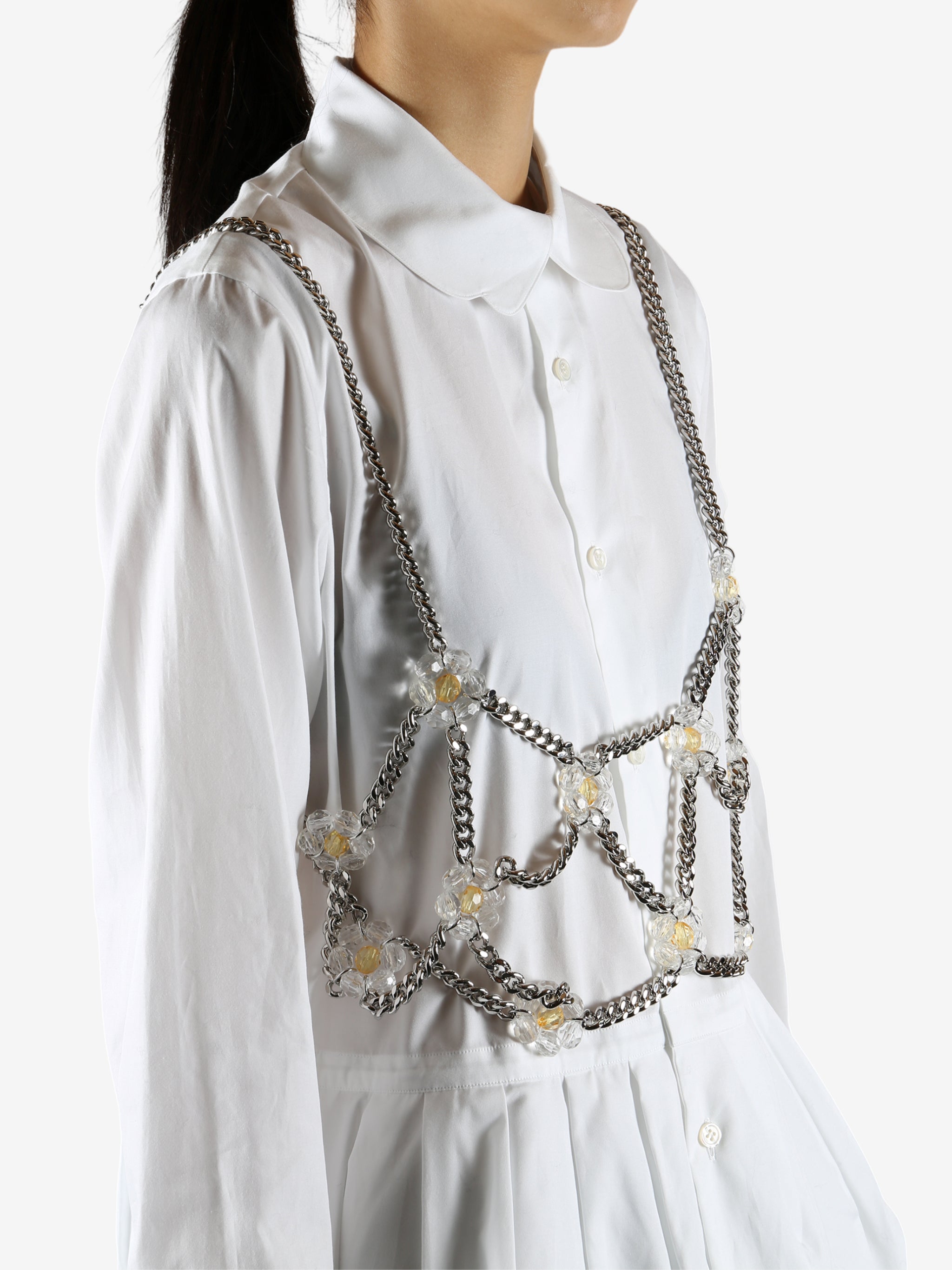 White top worn by a person, showing the top's fit