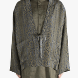 Blue jacket worn by a person, showing the jacket's fit