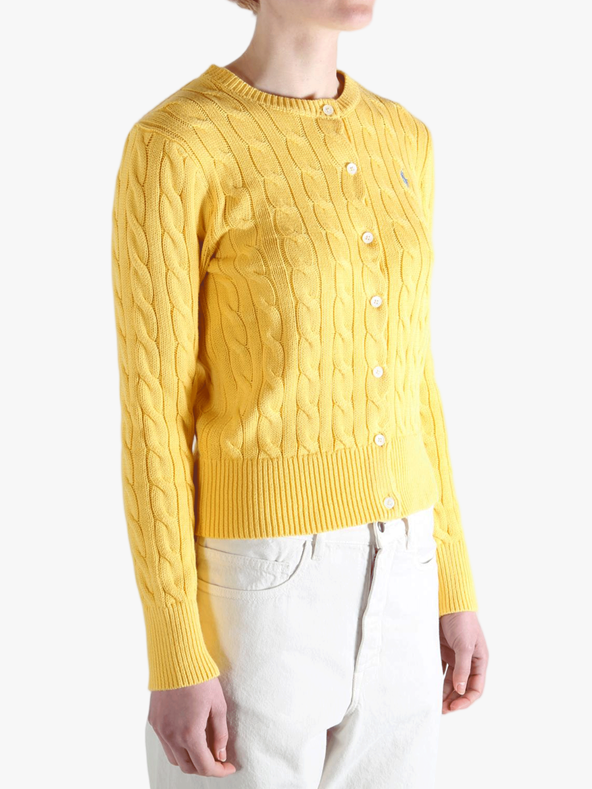 Yellow knitwear worn by a person, showing the  knitwear's fit