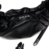 Close up of black bag,showing texture of the polyurethane fabric.