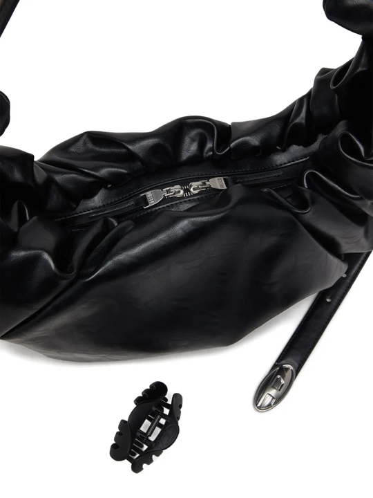 Close up of black bag,showing texture of the polyurethane fabric.