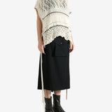 White vests worn by a person, showing the vests fit