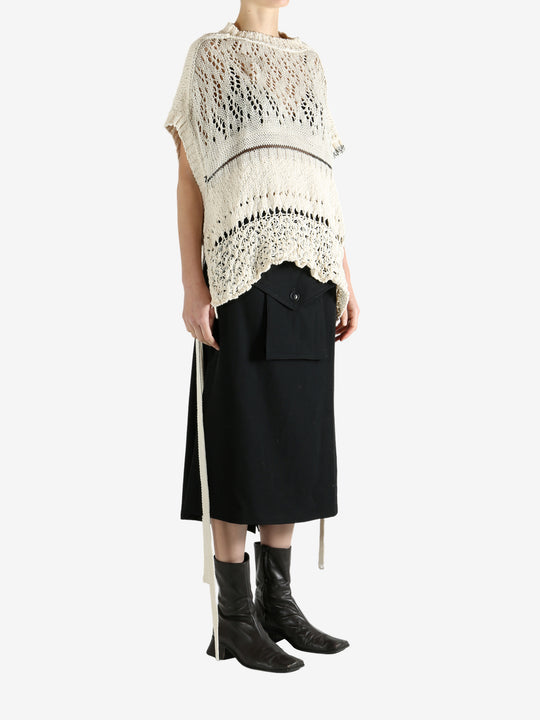 White vests worn by a person, showing the vests fit