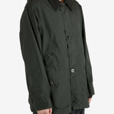 Green jackets worn by a person, showing the jacket’s fit