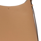 Close up of tan bag,showing texture of the leather fabric.