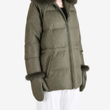 Green jacket worn by a person, showing the jacket fit