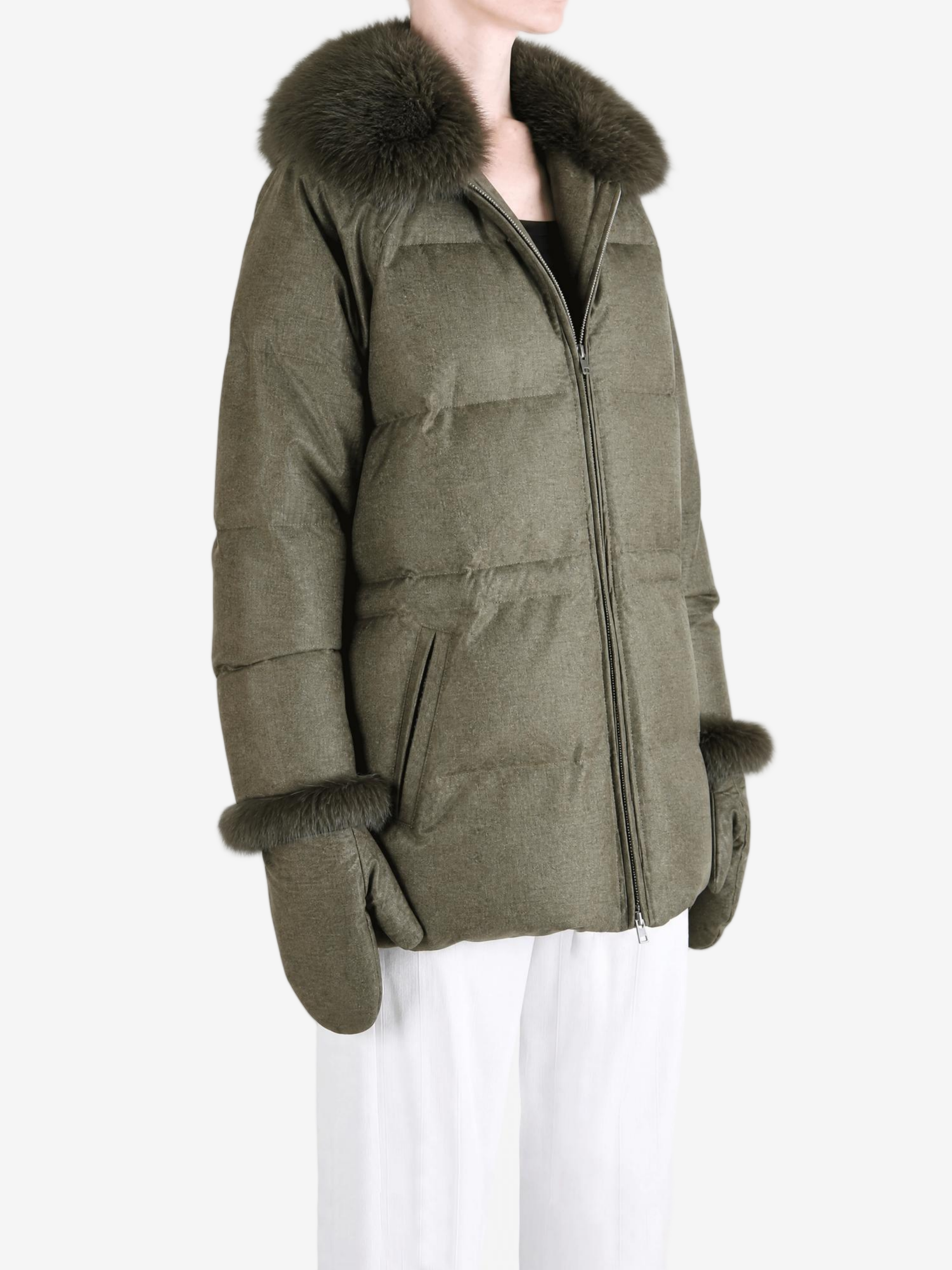 Green jacket worn by a person, showing the jacket fit