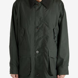 Green jackets worn by a person, showing the jacket’s fit