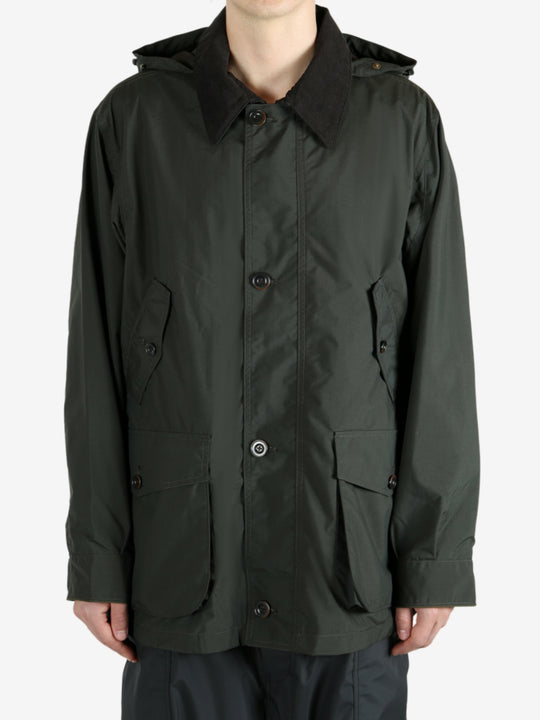 Green jackets worn by a person, showing the jacket’s fit