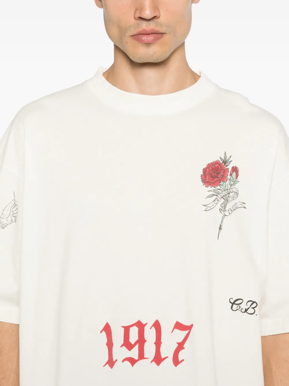 White t-shirt worn by a person, showing the t-shirt fit