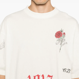 White t-shirt worn by a person, showing the t-shirt fit