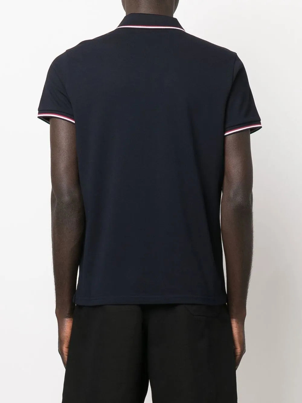 Navy t-shirt worn by a person, showing the t-shirt fit