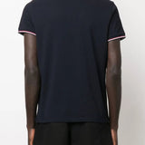 Navy t-shirt worn by a person, showing the t-shirt fit