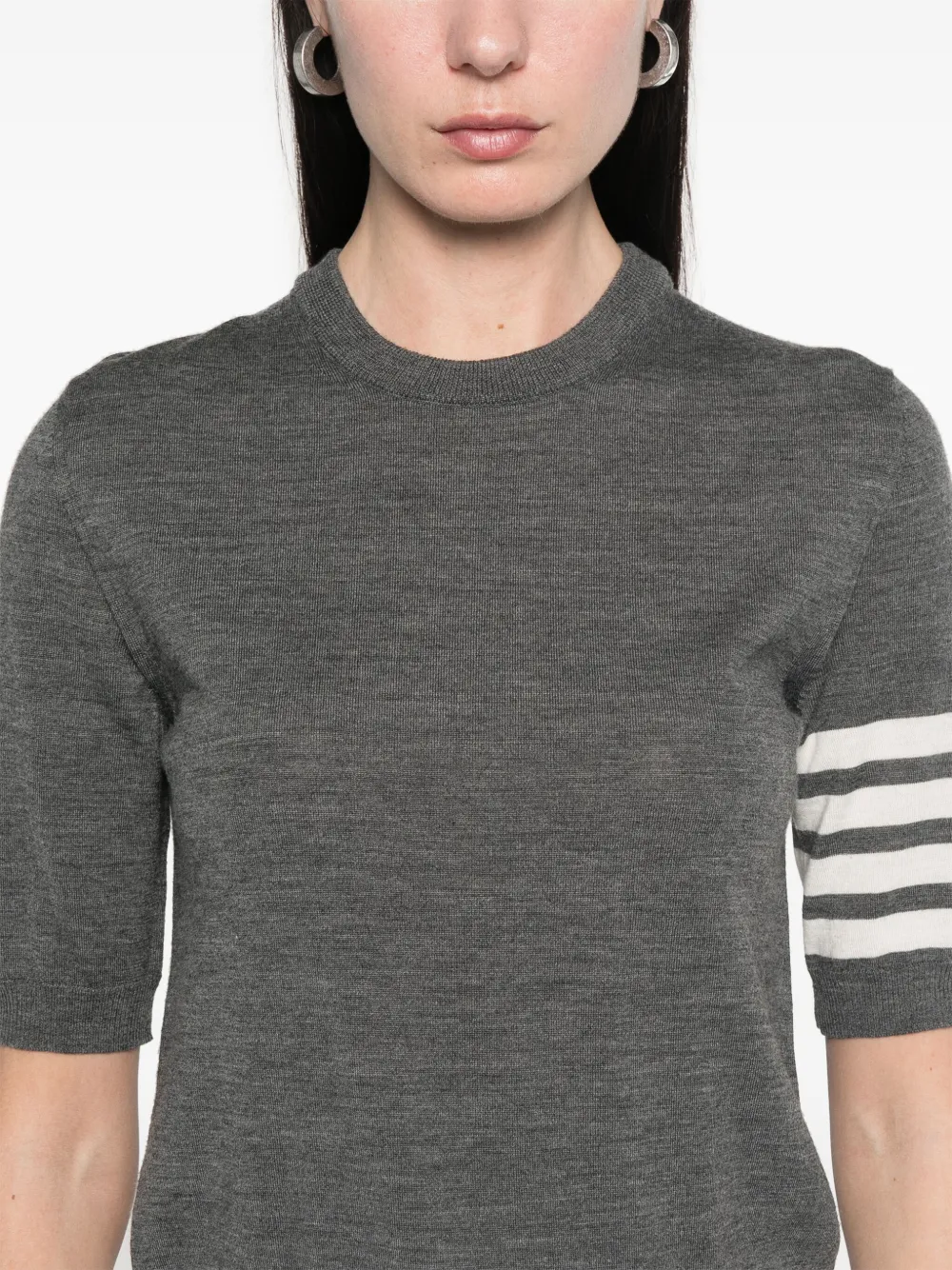 Close up of grey t-shirts, showing texture of the virgin wool and polyamide fabric
