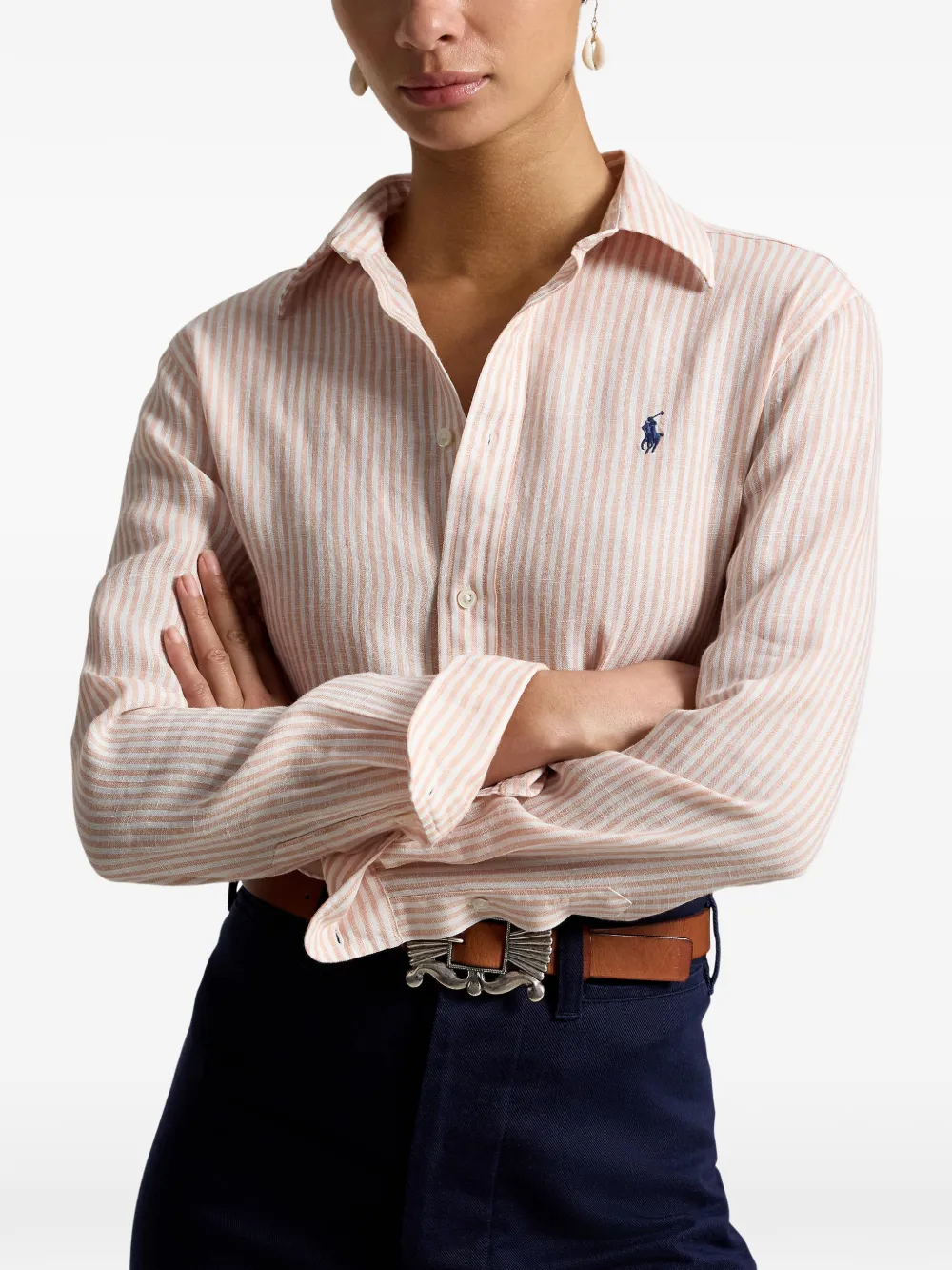 Pink knitwear worn by a person, showing the knitwear fit