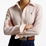 Pink knitwear worn by a person, showing the knitwear fit