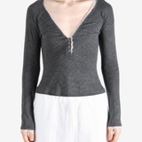 Grey top worn by a person, showing the top fit