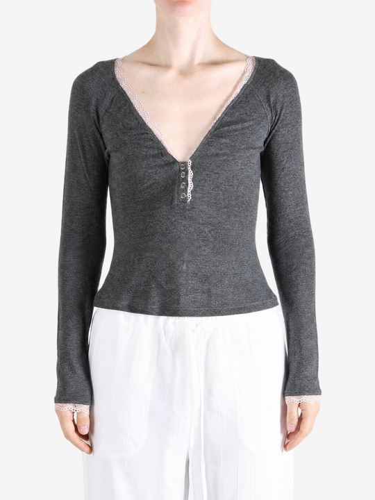 Grey top worn by a person, showing the top fit