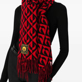 Red scarf worn by a person, showing the bag's fit