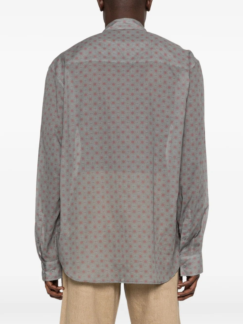 Grey shirt worn by a person, showing the shirt's fit