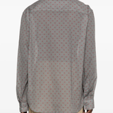 Grey shirt worn by a person, showing the shirt's fit