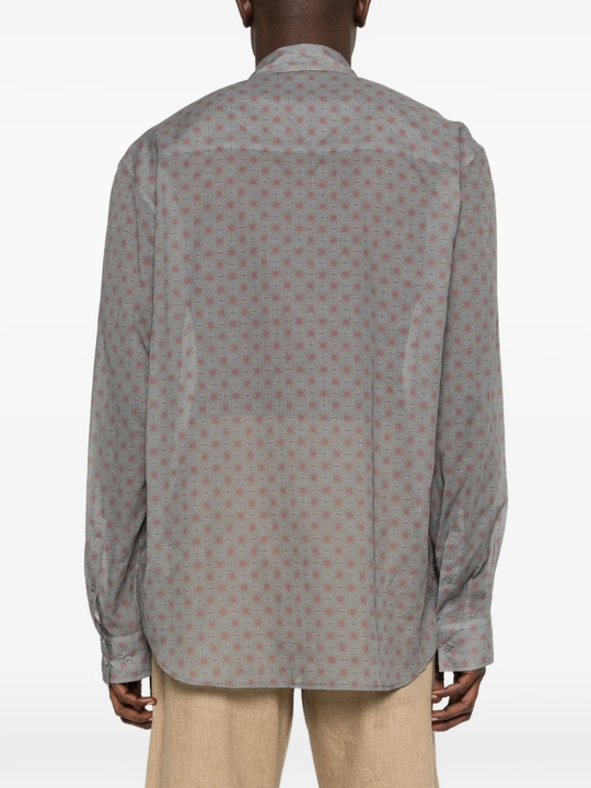 Grey shirt worn by a person, showing the shirt's fit