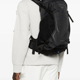 Black bag worn by a person, showing the bag fit