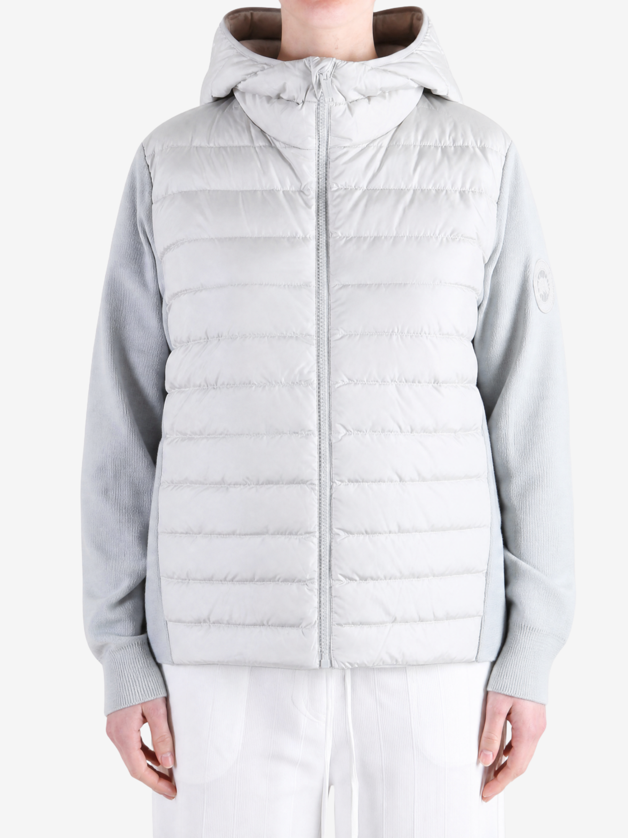 White hoodie worn by a person, showing the hoodie fit