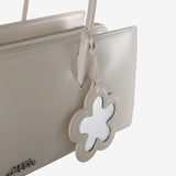 Close up of  white bag,showing texture of the leather fabric.