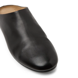 Close up of black shoes, showing texture of the  Calf Leather fabric 