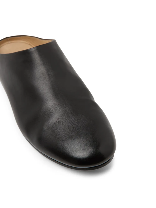 Close up of black shoes, showing texture of the  Calf Leather fabric 