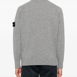 Grey sweats worn by a person, showing the sweats' fit