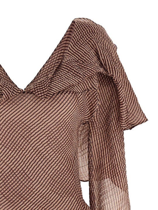 Close up of burgundy tops, showing texture of the silk fabric