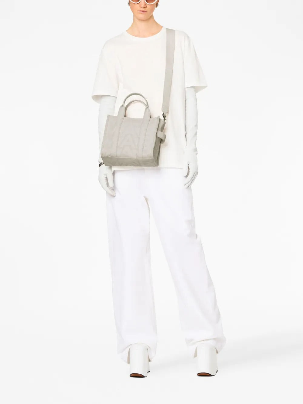 White bag worn by a person, showing the bag's fit