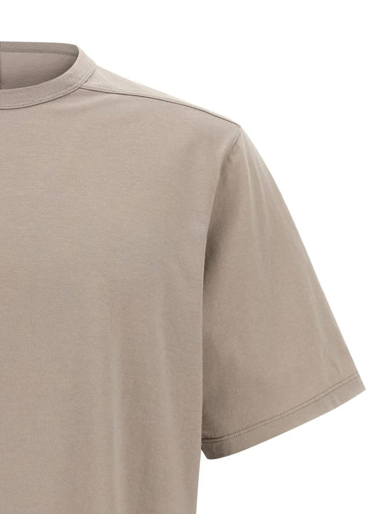 Close up of tan t-shirts, showing texture of the cotton fabric