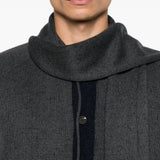 Grey knitwear worn by a person, showing the knitwear fit