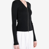 Black top worn by a person, showing the top fit