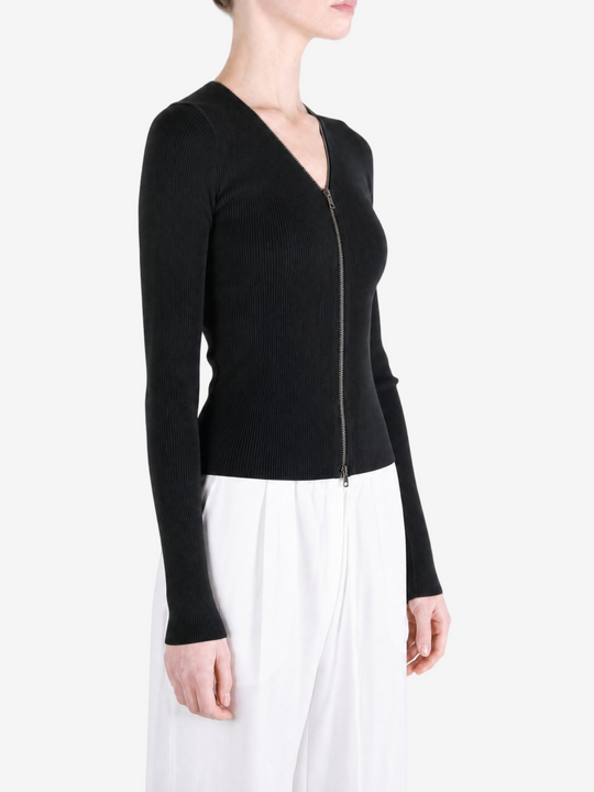 Black top worn by a person, showing the top fit