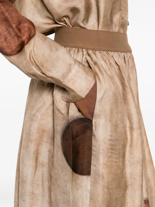 Close up of tan skirt, showing texture of the viscose fabric