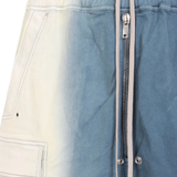 Close up of the blue pant, showing texture of the cotton fabric