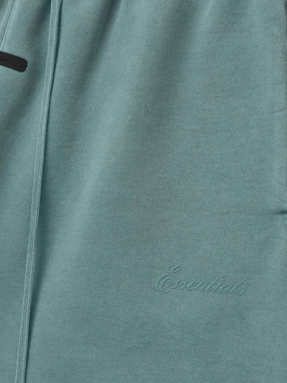 Close up of blue shorts, showing texture of the cotton fabric