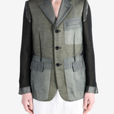 Grey jacket worn by a person, showing the jacket fit