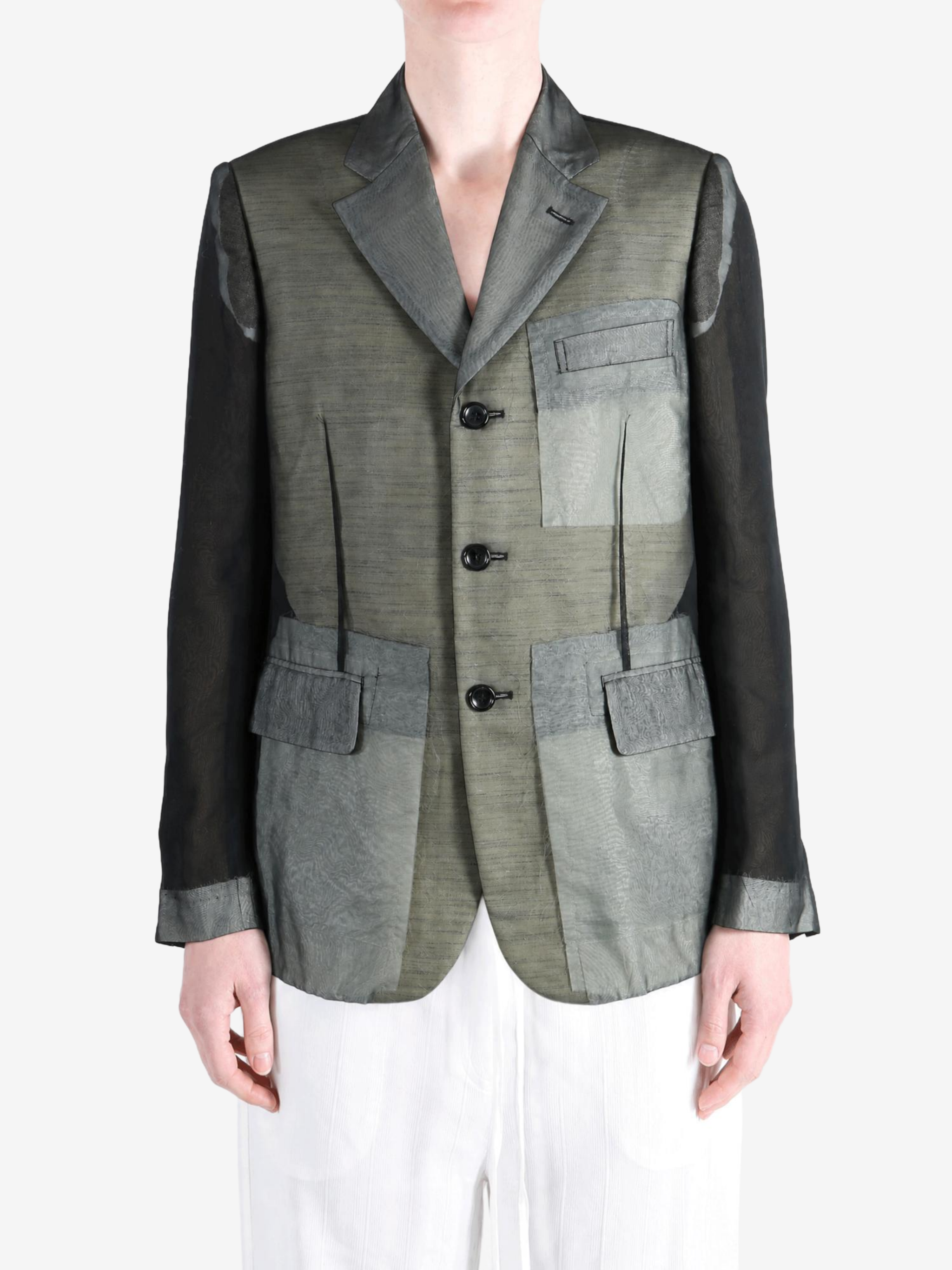 Grey jacket worn by a person, showing the jacket fit