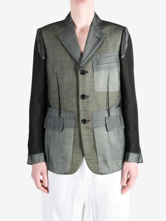 Grey jacket worn by a person, showing the jacket fit